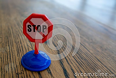 Isolated plastic toy warning sign - STOP. Danger ahead, do not enter Stock Photo