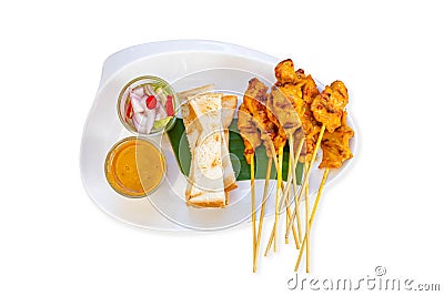 Isolated Pork Satay with coconut milk and bread with sauce in white plastic plate on a white background Stock Photo