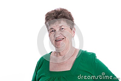 Isolated portrait of brunette smiling senior woman over white. Stock Photo