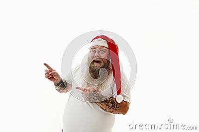 Isolated portrait on a white background of an overweigh man in Santa Claus hat gesturing with finger. copy space Stock Photo