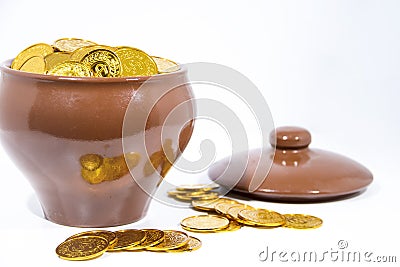 Isolated pot with golden coins. Abstract photo of lucky Stock Photo