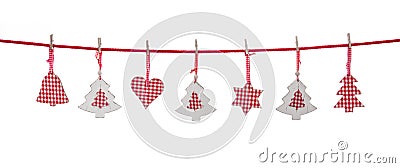 Isolated red and white christmas decoration hanging on a line. Stock Photo