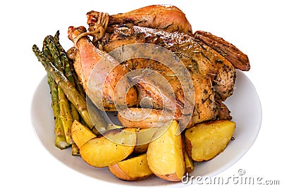 Isolated roasted whole chicken on a plate Stock Photo