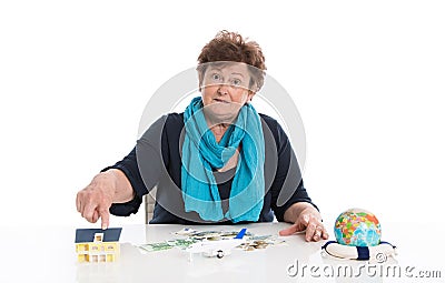 Isolated senior woman think about her money - concept for pension. Stock Photo