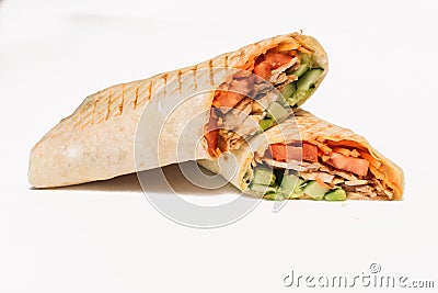 Isolated shawarma with a shadow. Oriental food made from chicken meat, tomatoes, cucumbers in pita bread Stock Photo