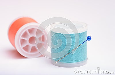 Isolated thread spools with pin on white background Stock Photo