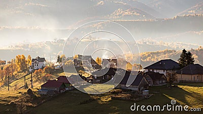 Isolated traditional Romanian houses built somewhere in a valley in Transylvania Stock Photo