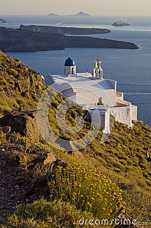 Isolated White Church by the Sea in Santorini Stock Photo