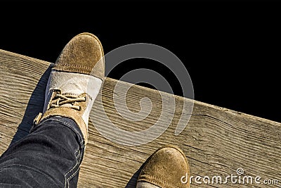 Feet in shoes on wooden background Stock Photo