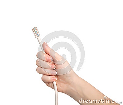 Isolated woman hand holding computer cable Stock Photo