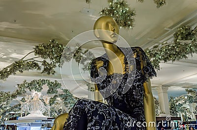 Isolated Woman Mannequin in Deep Blue Dress. Clothes Display Doll inside a Fashion Department Store. Editorial Stock Photo