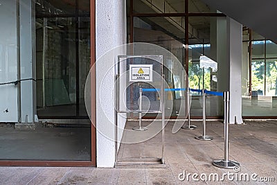 Isolation Area Sign on an Empty Building Stock Photo