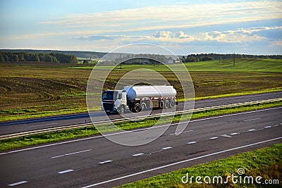 Isothermal Tank truck driving on highway. Oil and Gas Transportation and Logistics. Editorial Stock Photo