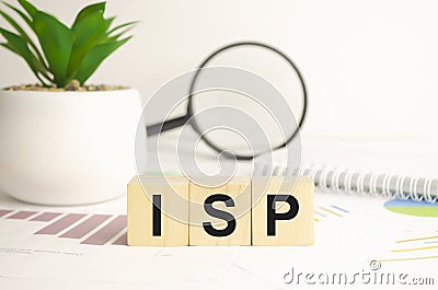 isp sign on wooden cubes and magnifier Stock Photo