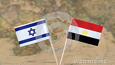 Israel and Egypt flag pins on a world map, political or diplomatic relations concept Stock Photo