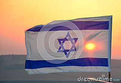 Israel flag with Star of David against sunset Stock Photo