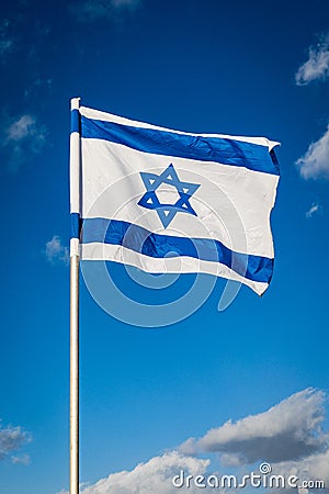 Israel flag waving cloudy sky background sunset Stock Photo