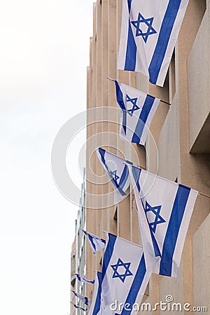 Israel flags hung on bulding exterior for solidarity after October 7 Hamas attack Editorial Stock Photo