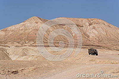 Israeli army Humvee on patrol in the desert Stock Photo