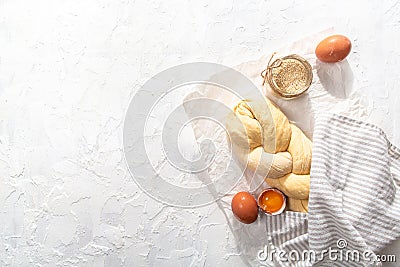 Israeli authentic food. Raw challah bread on baking paper background. home baking Stock Photo