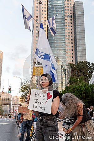 Israeli civillians gathered in solidarity for ceasefire between Israel and Gaza, holding banners for the missing and kidnapped Editorial Stock Photo