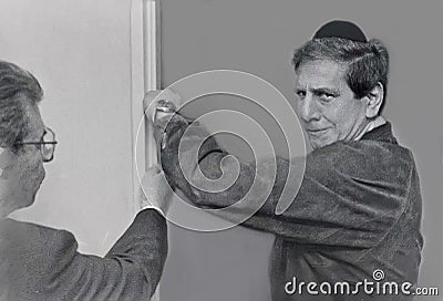 Chaim Topol Affixes a Mezuzah in Tel Aviv Editorial Stock Photo