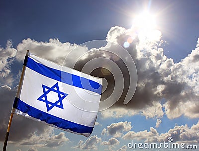 Israeli flag against cloudy sky Stock Photo