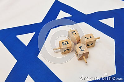 Israeli Flag with Wooden Dreidels Stock Photo