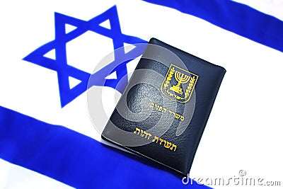 Israeli passport on the flag of Israel. Israeli citizenship, Israeli citizen, Repatriation, Emigration Stock Photo