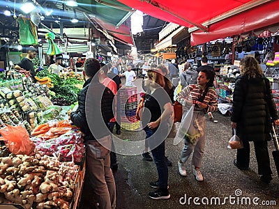 Israeli people buy fresh produce in Carmel Market in Tel Aviv Israel Editorial Stock Photo