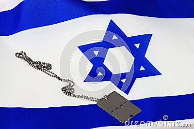 Israeli Soldier Medallion and Flag of Israel. Themes: Soldiers Tzahal IDF - army Israel , Yom HaZikaron Memorial Day Stock Photo