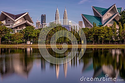 Istana Budaya National Theatre building and the Petronas Twin Towers Editorial Stock Photo