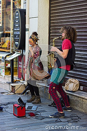 Istanbul, Istiklal Street / Turkey 9.5.2019: Street Musicians Performing their Show, Saxophone Artist in the Istiklal Street Editorial Stock Photo