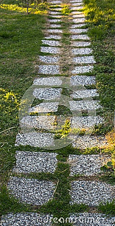 Tile path on a green lawn. Istanbul park Stock Photo