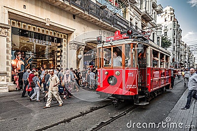 ISTANBUL, TURKEY - AUGUST 8, 2015: Tram going via one of the most famous avenues in Istanbul - Ä°stiklal Caddesi Editorial Stock Photo