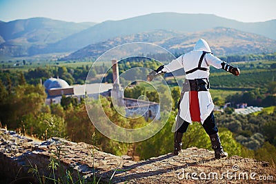 Istanbul, Turkey - 12 July 2015: Cosplay festival in Turkey, actor posing near medieval castle assassins creed concept Editorial Stock Photo