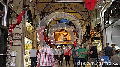 Tourists walk along passage among souvenir shops and stores Editorial Stock Photo