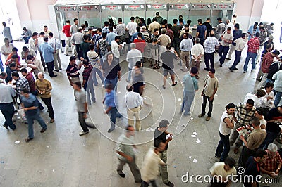 Horseracing fans taking tickets from the box office Editorial Stock Photo