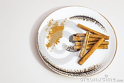 Istanbul,turkey-june 16,2020.crusted and powdered cinnamon on a decorative plate. Editorial Stock Photo