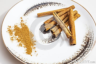 Istanbul,turkey-june 16,2020.crusted and powdered cinnamon on a decorative plate. Editorial Stock Photo