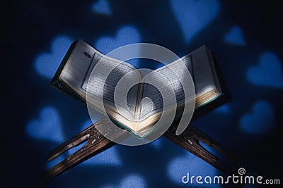 Istanbul, Turkey - June 1, 2018; An open page of Quran shows Surah Al-Baqarah on blue background. Quran is an Islamic holy book Editorial Stock Photo