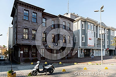 ISTANBUL, TURKEY - MARCH 25, 2023: wooden historic building on Istanbul street home and motorcycle Editorial Stock Photo