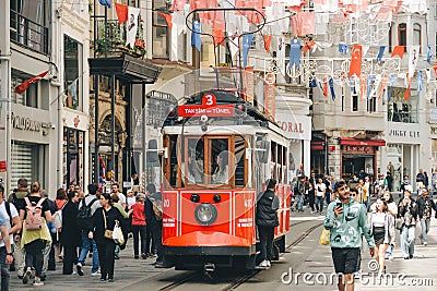 Istanbul, Turkey - May 02, 2023: Nostalgic traditional red tram in Beyoglu. The tram line runs along Istiklal Editorial Stock Photo