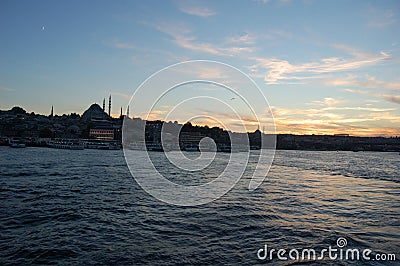 Istanbul (Turkey). Night cruise on the Bosphorus. Golden Horn. Illuminated Galata Bridge. Sunrise Editorial Stock Photo