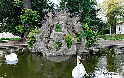 Istanbul, Turkey- October 6, 2021: Fountain with swans of Dolmabahce Palace during spring rain Editorial Stock Photo