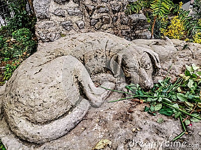 Monument to the faithful dog and a cat in Istanbul at the foot of the Galata Tower. Stone Editorial Stock Photo