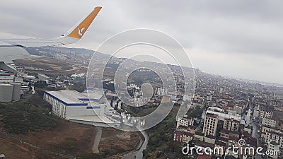 A Pegasus airline plane comes in for landing in Istanbul above the clouds at high altitude close up Editorial Stock Photo