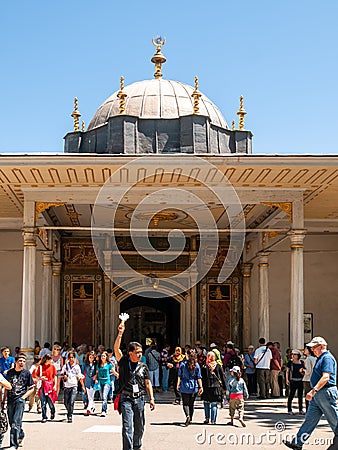 Istanbul / Turkey Tour guide raising hand, tourists, visitors at Topkapi palace inner yard Editorial Stock Photo