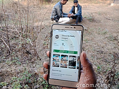 istock by Getty images royalty free stock photography app displayed on digital screen holded hand mobile concept in India dec 2019 Editorial Stock Photo