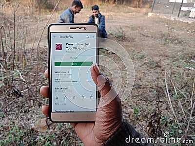 dreamstime royalty free stock photography app displayed on digital screen holded hand mobile concept in India dec 2019 Editorial Stock Photo